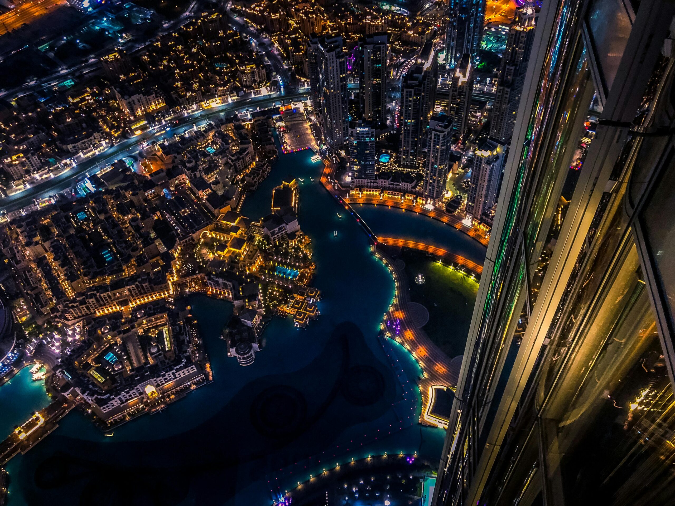 Dubai Visa Guide for Indian Citizens (2025) Vibrant aerial cityscape of Dubai at night with illuminated skyscrapers and urban landscape.